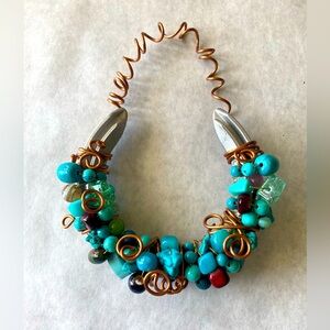 Hand crafted beaded Horse shoe decor. Turquoise colors.